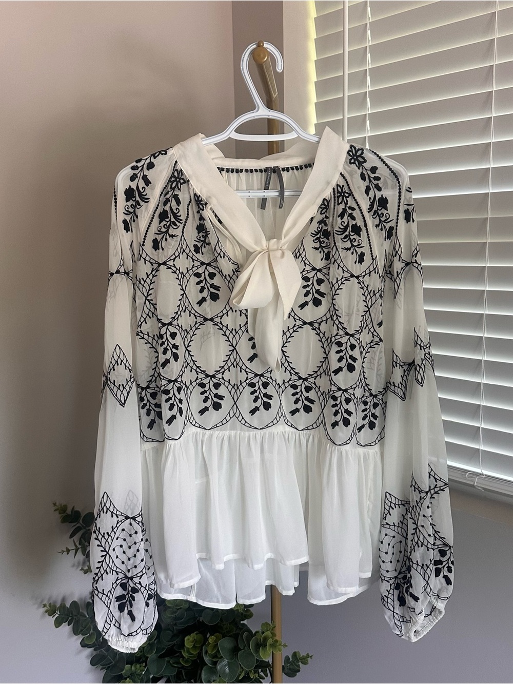 Anthropologie White Blouse with Black Floral Embroidery and Tie Neck